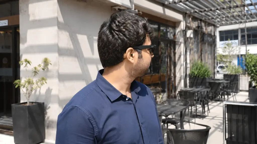 Meta Ray-Ban smart glasses with transition lenses turned dark in bright sunlight.